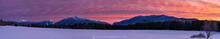 Adirondack Loj Road snowy fields with classic profile of High Peaks under brilliant sunset