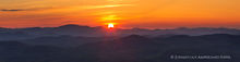 Buck Mt summit view of setting summer sun over Gore Mt telephoto panorama