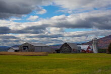 Wadhams area countryside farm with High Peaks peaking behind, Champlain Valley