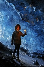 lantern-lit explorer Icelandic ice cave