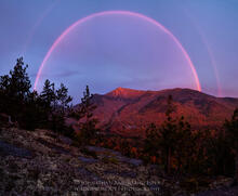 Double Rainbow over Whiteface Mt ski area with sunrise light hitting summit