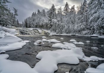 Buttermilk Falls on the Raquette River winter snowstorm