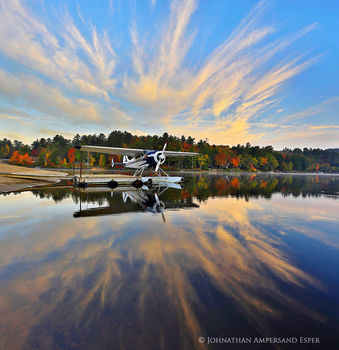 Long Lake town beach floatplane reflection