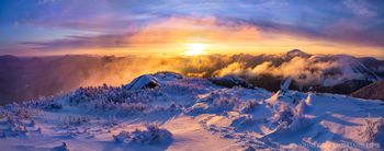 Wright Peak summit winter sunrise with snowshoe track