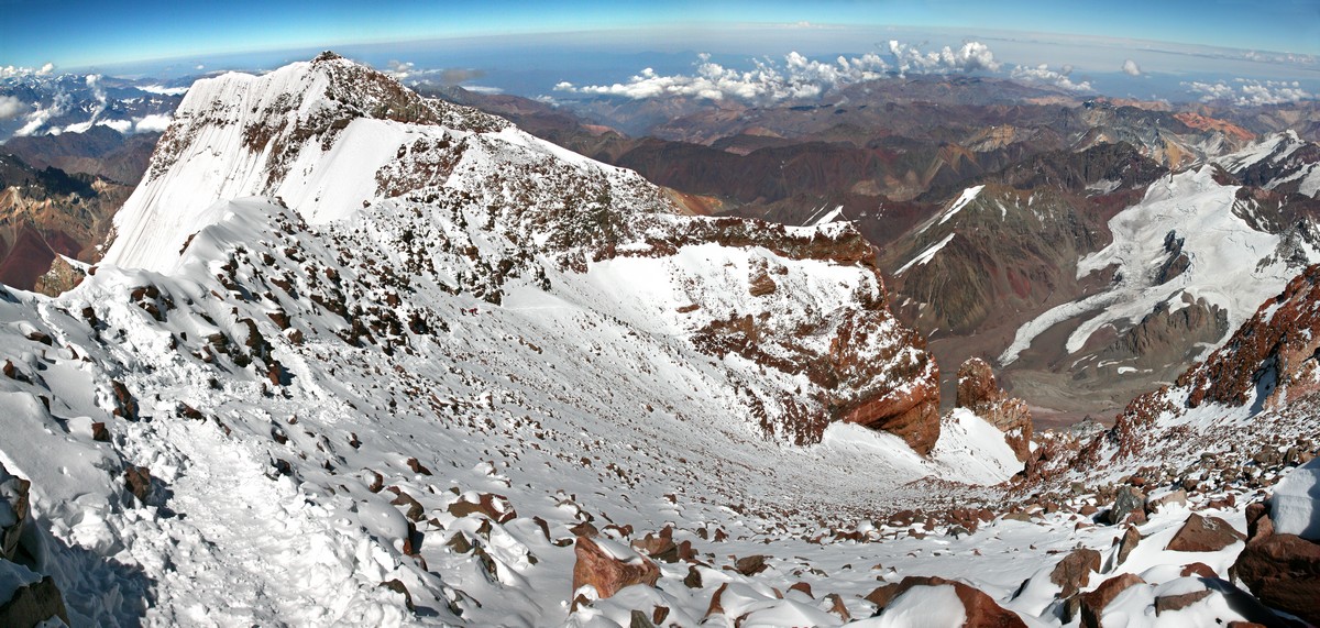 Mountaineerings are seen ascending, slowly, from the summit of Aconcagua.&nbsp;