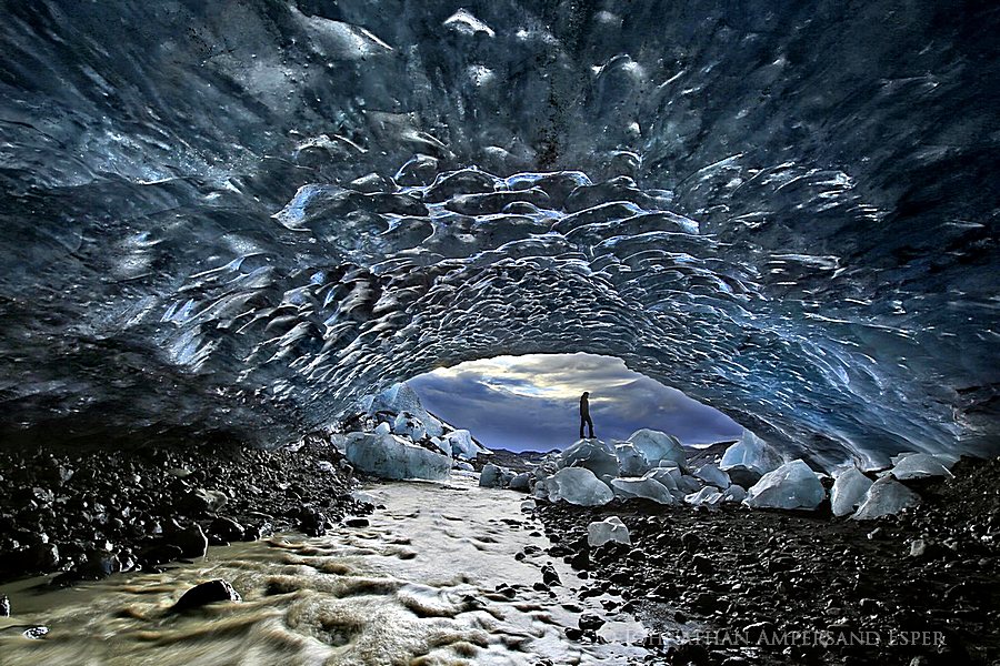 Vatnaj&ouml;kull glacier region ice cave, Iceland, ice guide and adventurer